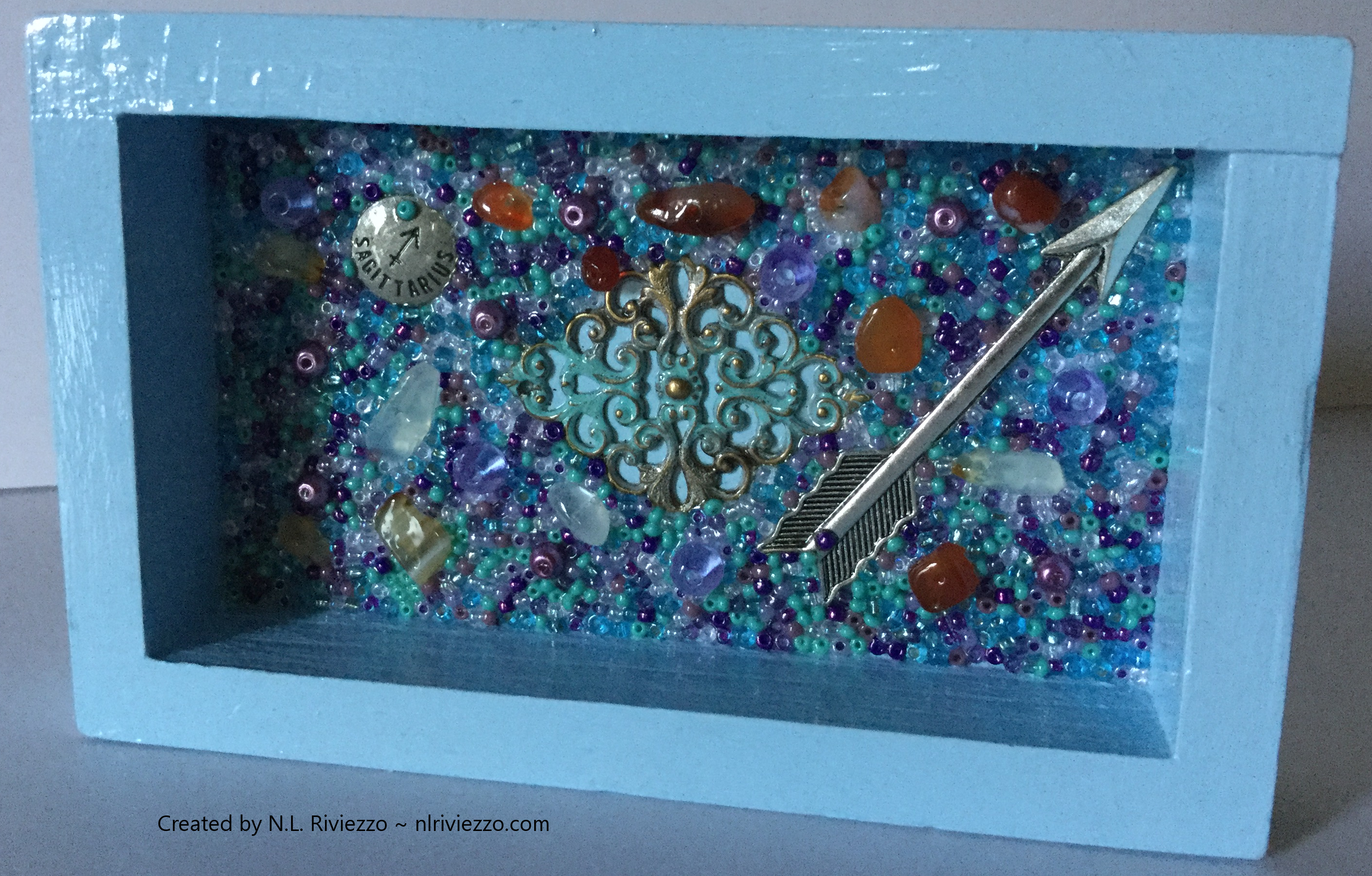 Sagittarius: Fire, Light Blue, Purple, and Tin