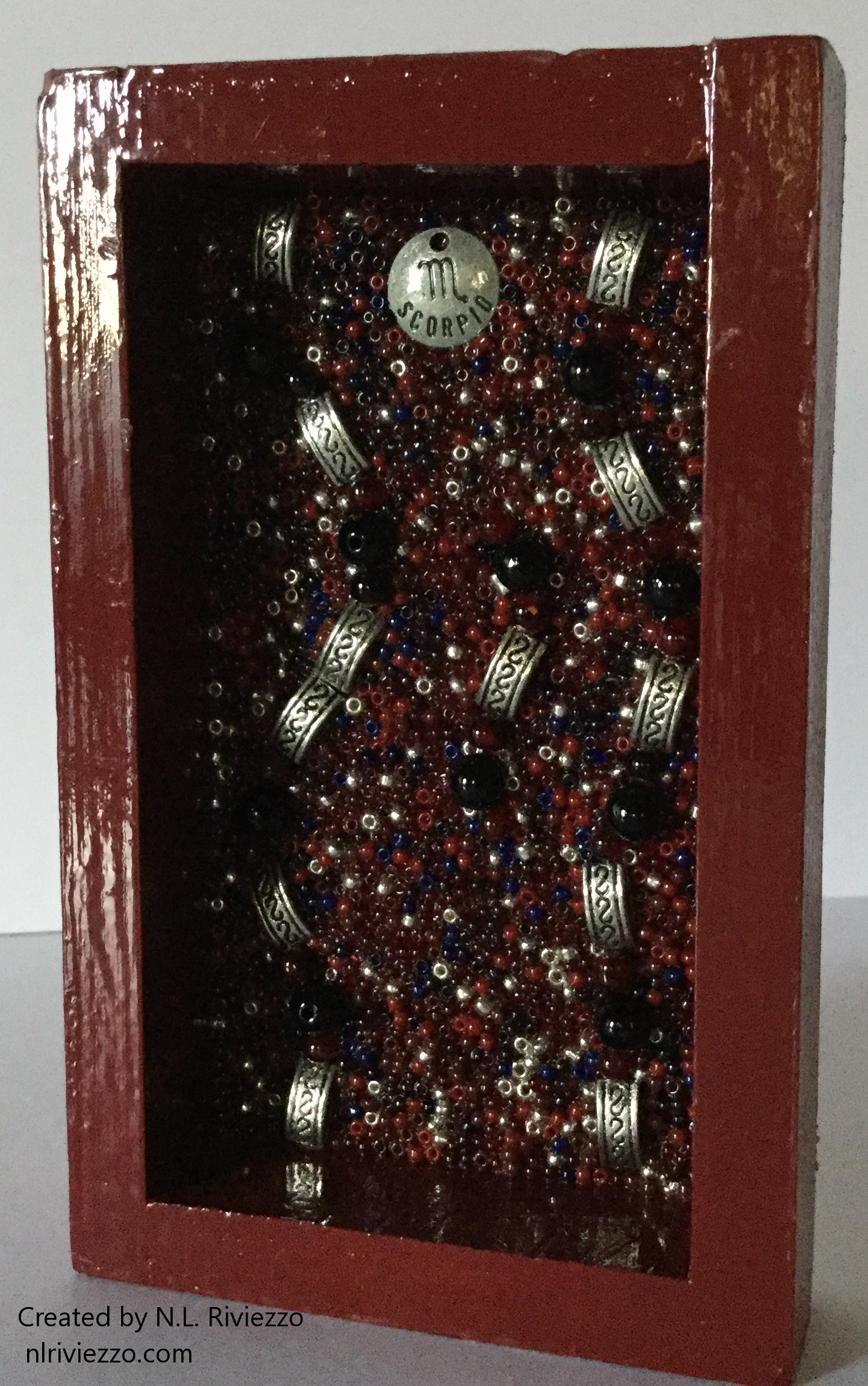 Scorpio: Water, Deep Red, and Steel